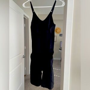 Shape wear black. Never worn one piece thigh length adjustable straps